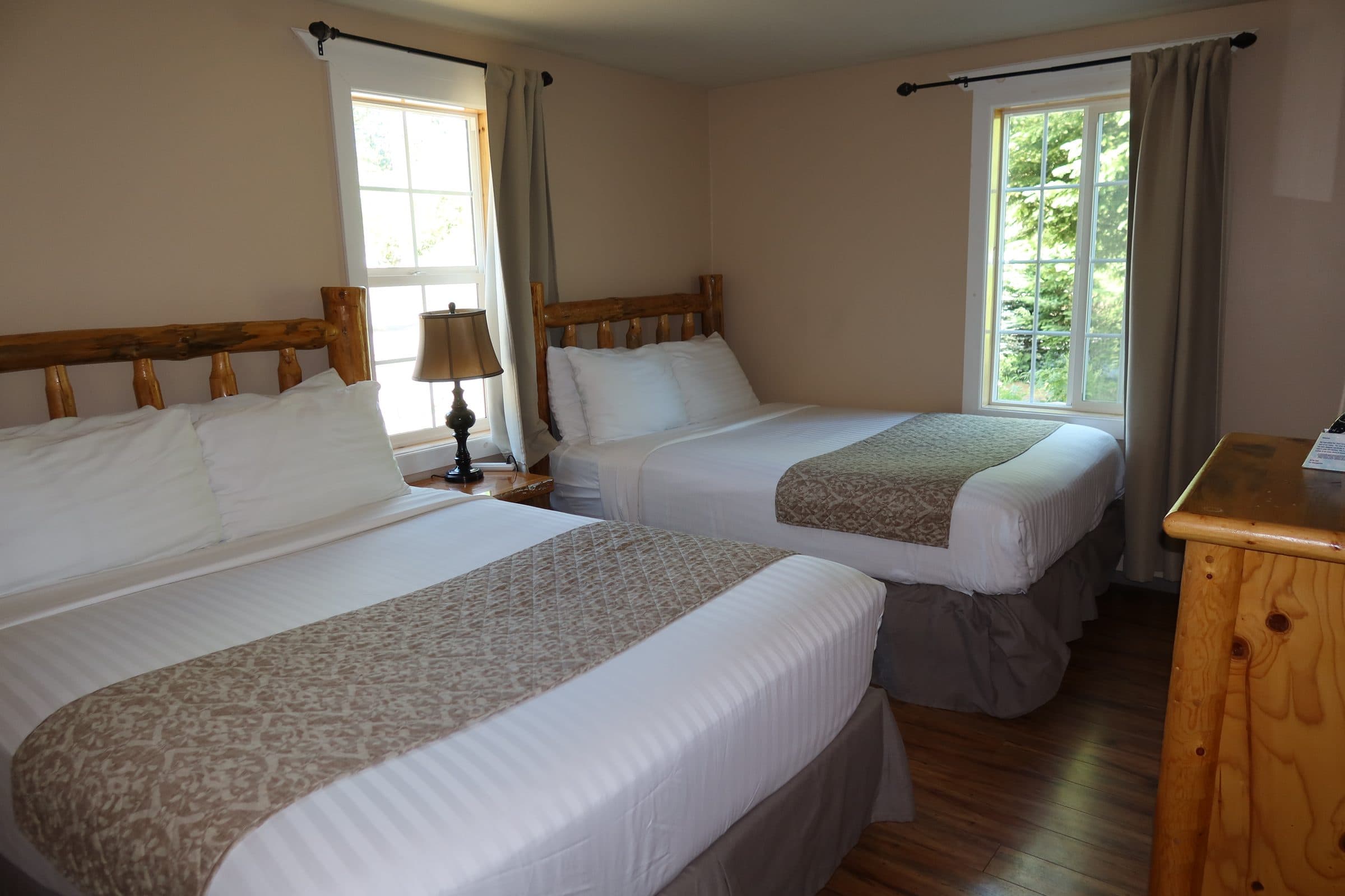 Room #17 interior with 2 queen beds and 1 sofa bed