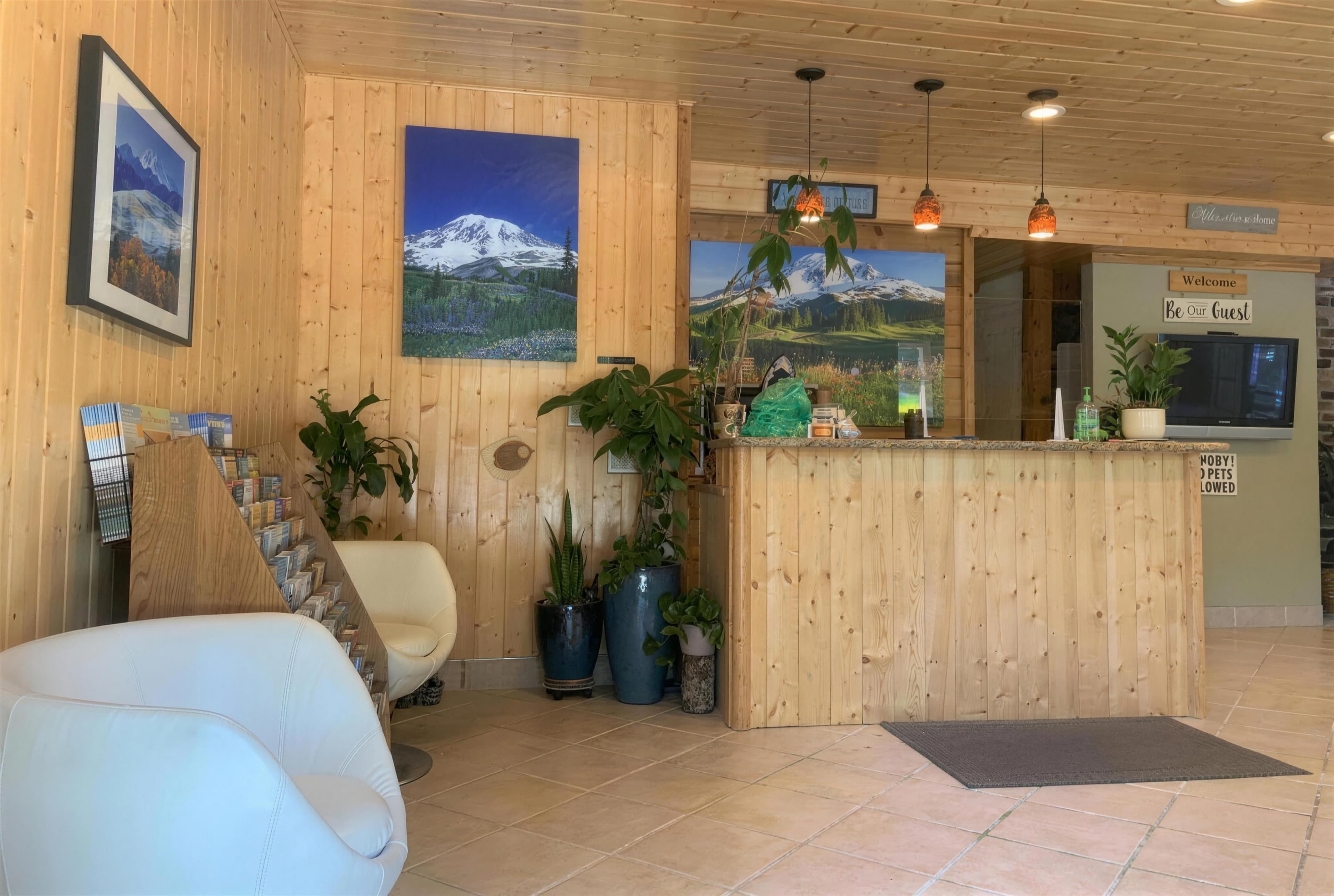 The front desk in the knotty-pine lobby
