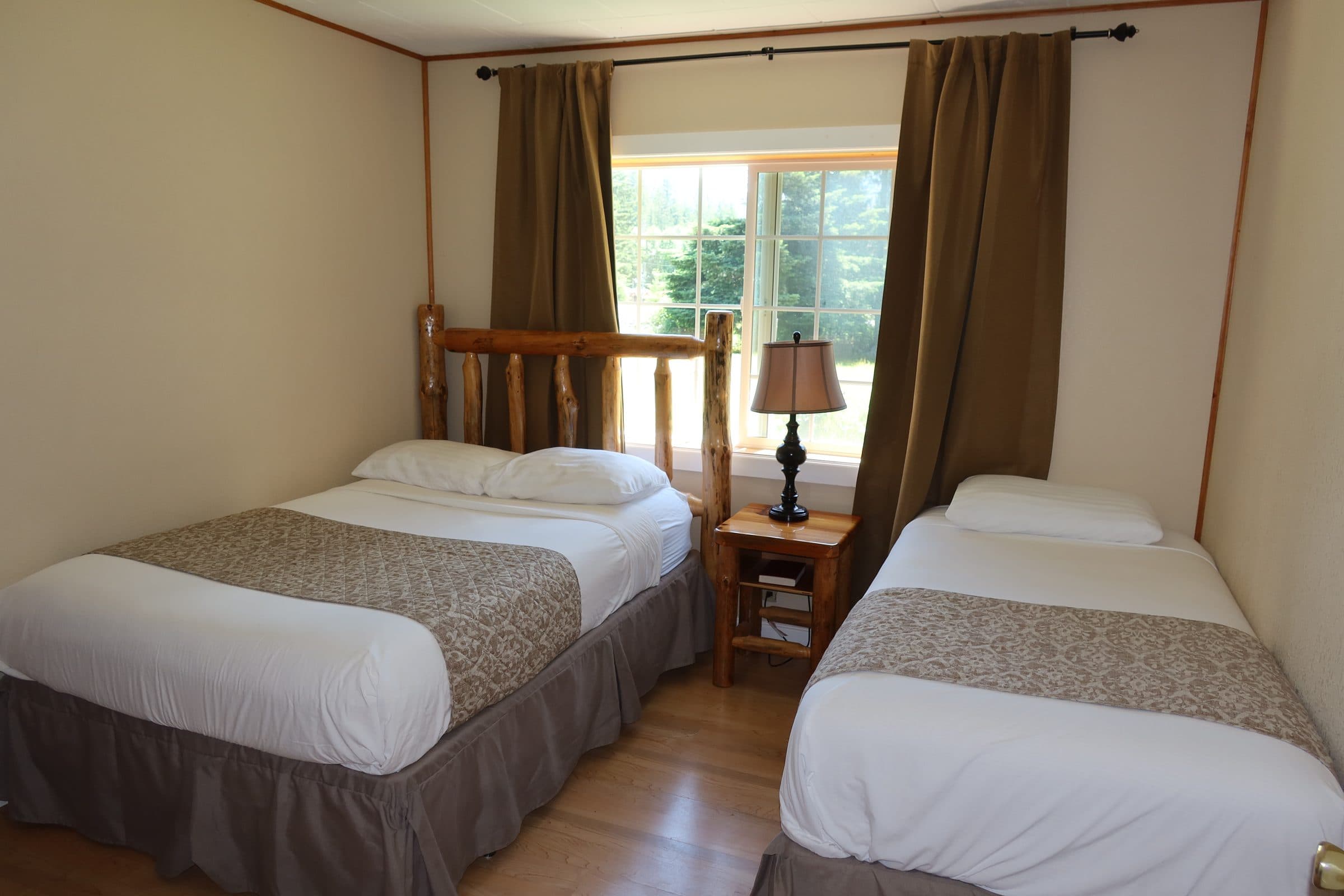 Room #4 interior with 1 queen bed, 1 double bed, and 1 twin bed